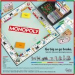 Monopoly board game set with game board cards dice tokens and property pieces